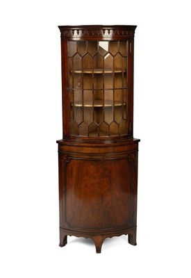 Lot 406 - A floor standing bowfronted corner cabinet