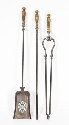 Lot 547 - A set of three steel and brass fire irons