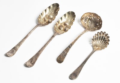 Lot 83 - A matched pair of Georgian silver and silver gilt berry spoons