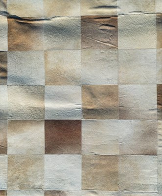 Lot 596 - A large patchwork cowhide carpet by Kravet