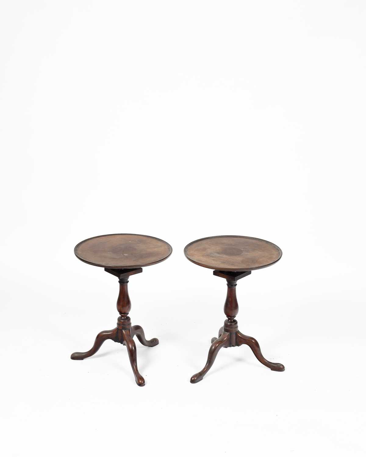 Lot 355 - A pair of mahogany tripod tables