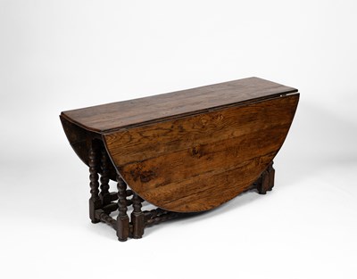 Lot 385 - An early 18th Century oak and elm gateleg table