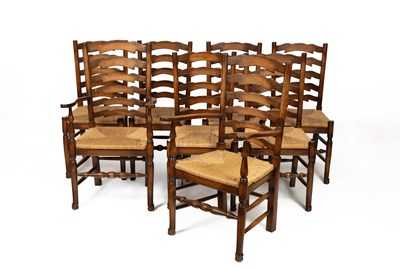 Lot 409 - A set of eight ladder back chairs