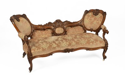 Lot 717 - A Victorian carved walnut framed settee