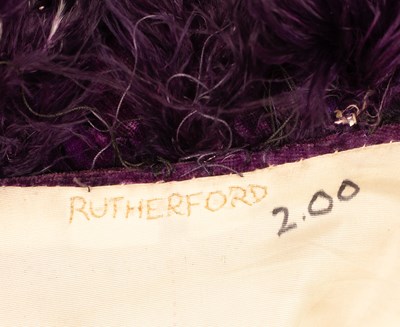 Lot 652 - A RSC purple velvet gown with purple feather boas to collar