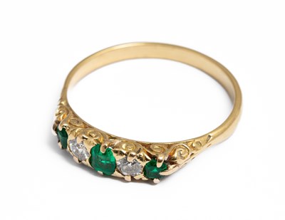 Lot 283 - An 18ct yellow gold emerald and diamond five-stone ring