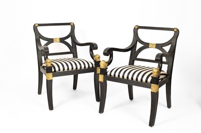 Lot 671 - A pair of ebonised Empire style chairs