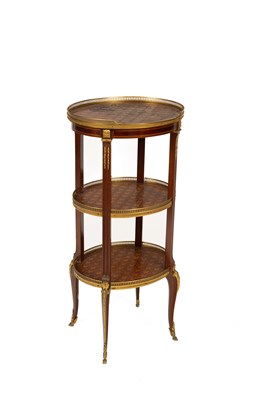 Lot 675 - A Louis XVI style three-tiered parquetry étagère