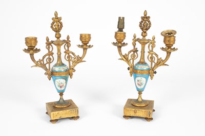 Lot 771 - A pair of 19th Century gilt metal candle sticks