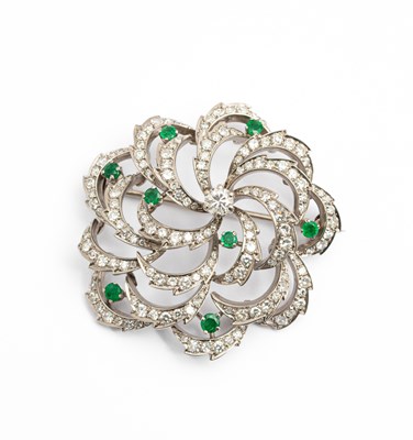 Lot 165 - A diamond and emerald circular floral brooch