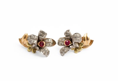 Lot 186 - A pair of yellow metal ruby and diamond floral earrings