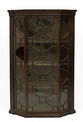 Lot 747 - A George III mahogany hanging corner cupboard