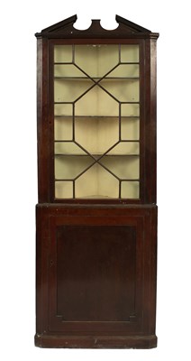 Lot 748 - A George III mahogany floor standing corner cupboard