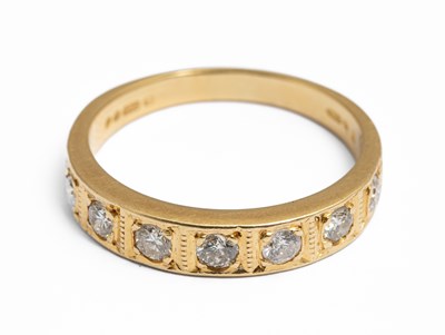 Lot 226 - An 18ct yellow gold and diamond half eternity ring