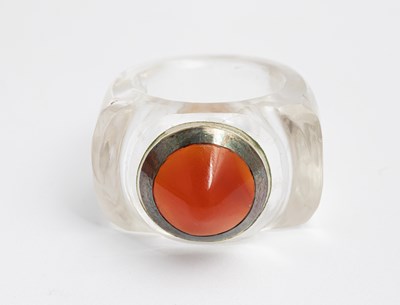 Lot 270 - An Art Deco rock crystal, carnelian and white metal ring