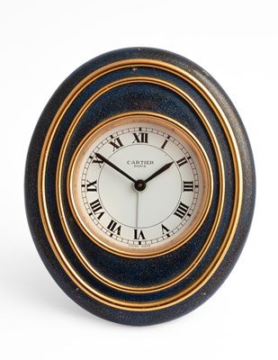 Lot 343 - A Cartier oval bedside alarm clock