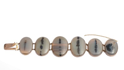 Lot 236 - A Victorian yellow metal and moss agate six panel bracelet