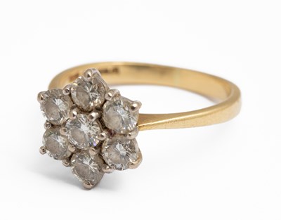 Lot 243 - An 18ct yellow gold and diamond seven stone cluster ring