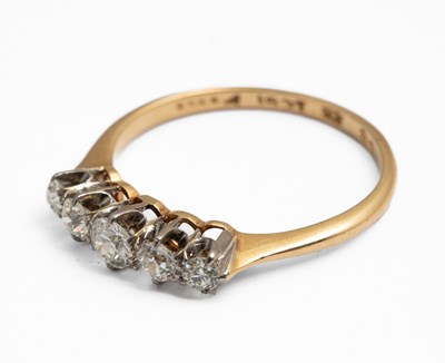 Lot 244 - An 18ct yellow gold and diamond five stone ring