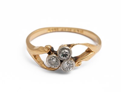 Lot 246 - An 18ct yellow gold and diamond three stone ring