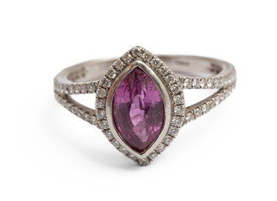 Lot 253 - A platinum pink sapphire and diamond dress ring