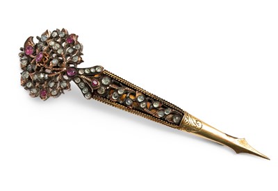 Lot 255 - A 19th century yellow metal ruby and paste set hair pin / brooch / kondakoora