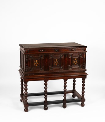 Lot 587 - An oak coffer on later stand