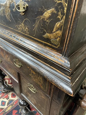 Lot 299 - An 18th Century and later black lacquer and gilt chinoiserie decorated chest on stand