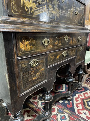 Lot 299 - An 18th Century and later black lacquer and gilt chinoiserie decorated chest on stand