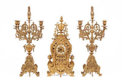 Lot 376 - A late 20th Century brass mantel clock garniture