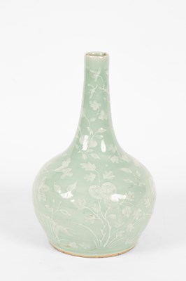 Lot 590 - A white painted celadon compressed bottle vase