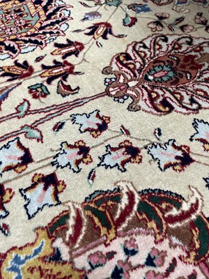 Lot 406 - A fine Tabriz carpet