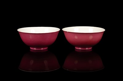 Lot 573 - A pair of pink monochrome bowls