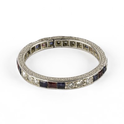 Lot 308 - An Art Deco diamond, sapphire and ruby eternity ring