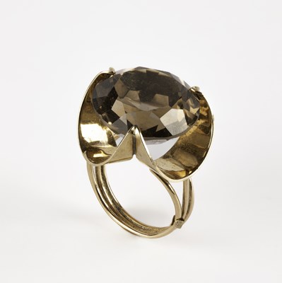 Lot 311 - A yellow gold and citrine dress ring