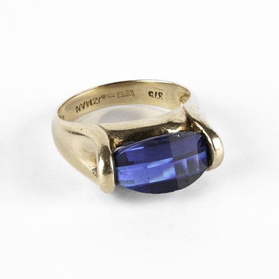 Lot 313 - A 9ct yellow gold and blue paste ring