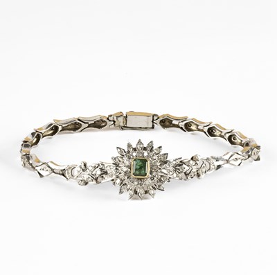 Lot 319 - An emerald and diamond articulated bracelet