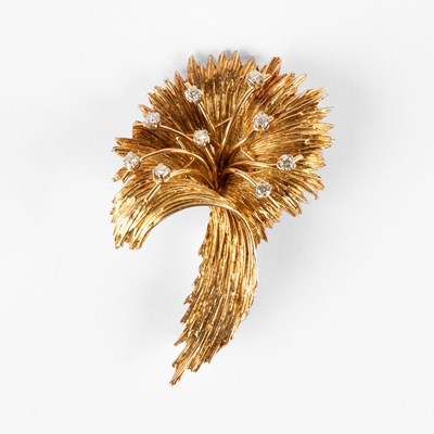 Lot An 18k yellow gold and diamond spray brooch