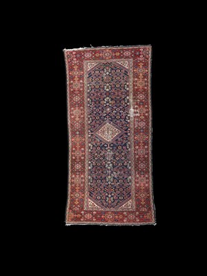 Lot 720 - A Feraghan long rug