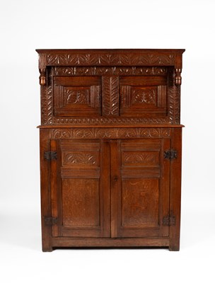 Lot 60 - A Charles II oak press cupboard