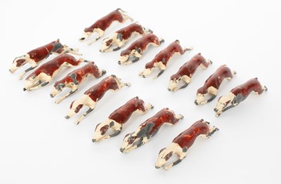 Lot 774 - A set of W. Britain painted metal running hounds