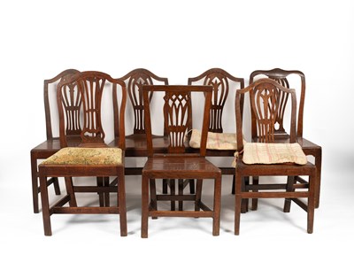 Lot 531 - A matched set of four George III oak splat back dining chairs