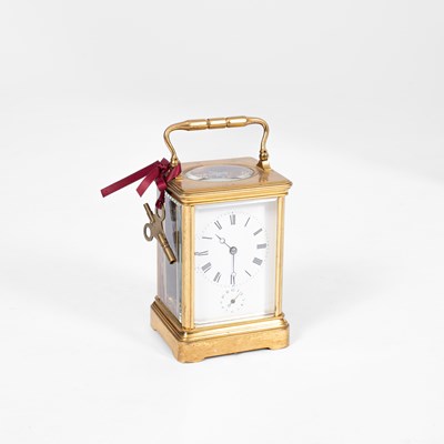 Lot 707 - A French lacquered brass cased carriage timepiece with alarm