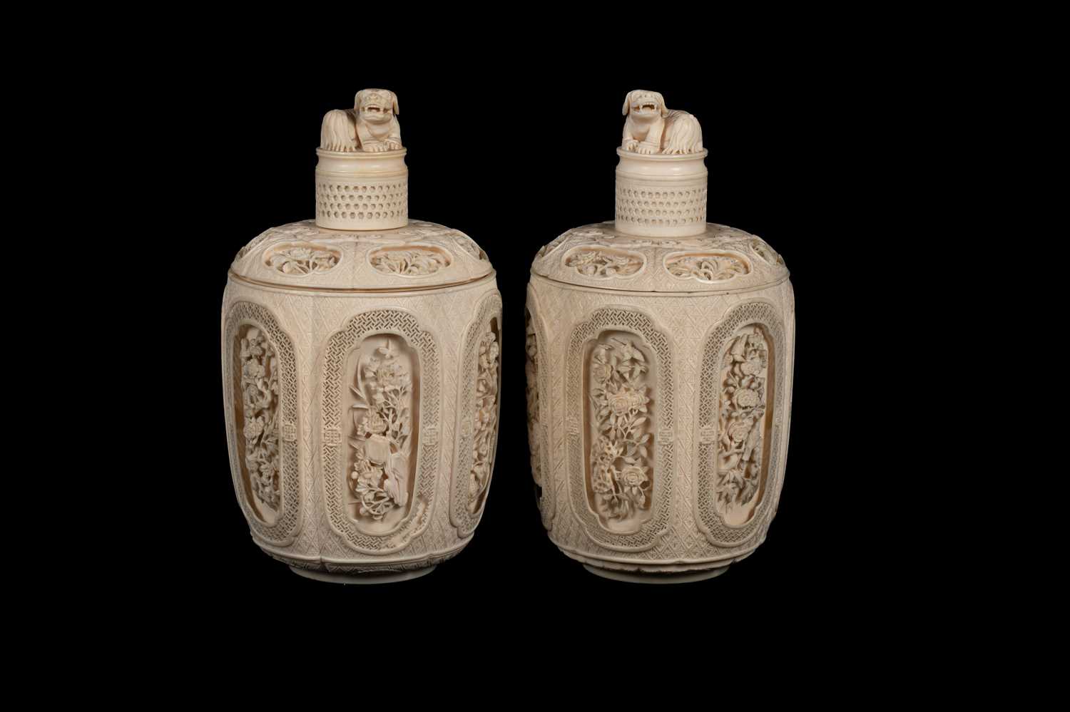 Lot 465 - A pair of Chinese carved ivory jars and covers