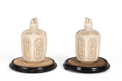 Lot 465 - A pair of Chinese carved ivory jars and covers