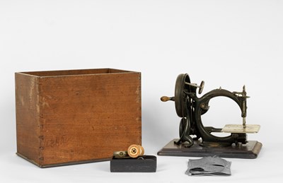 Lot 450 - A Wilcox & Gibbs sewing machine