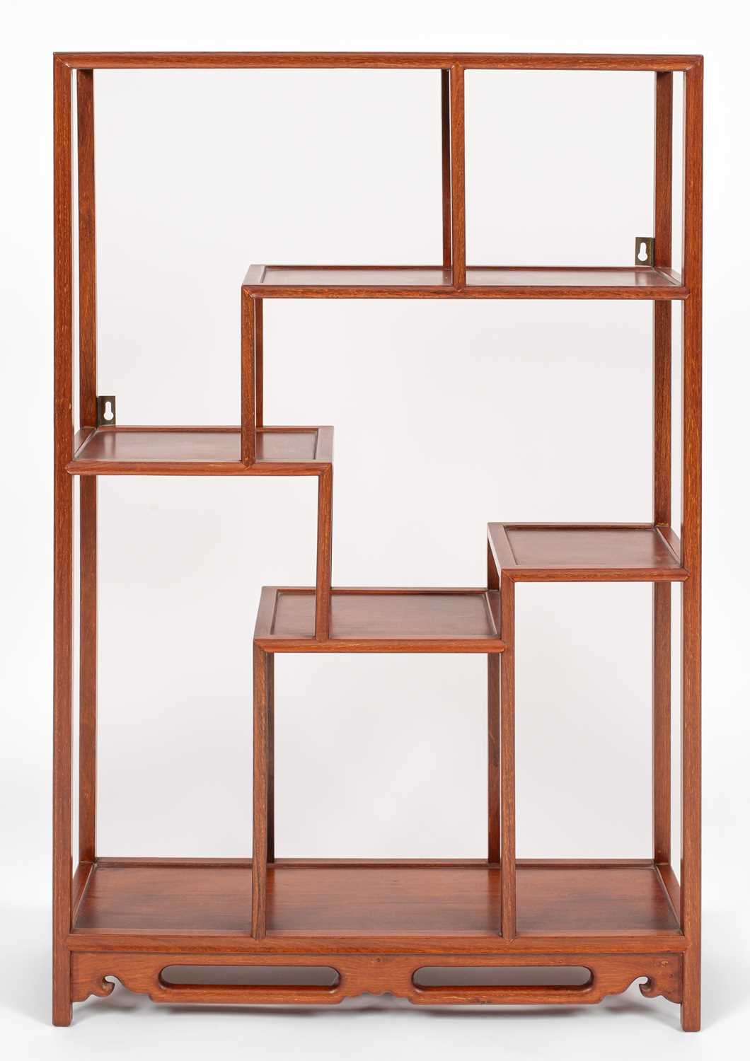 Lot 636 - A Chinese hardwood display shelf