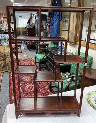 Lot 636 - A Chinese hardwood display shelf