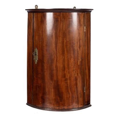 Lot 689 - A small 19th Century mahogany hanging corner cupboard