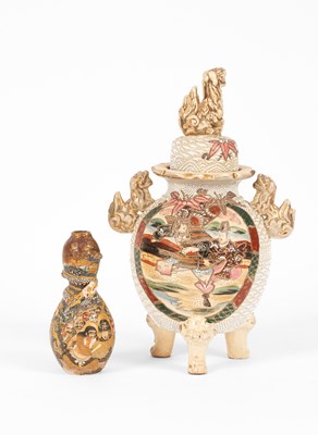 Lot 563 - A Japanese lidded two handled vase